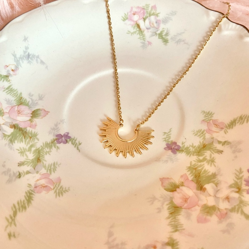 Gold half sun necklace